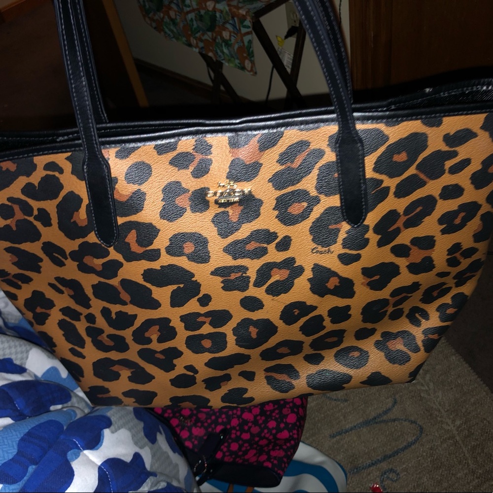 Woman’s cheetah print coach tote